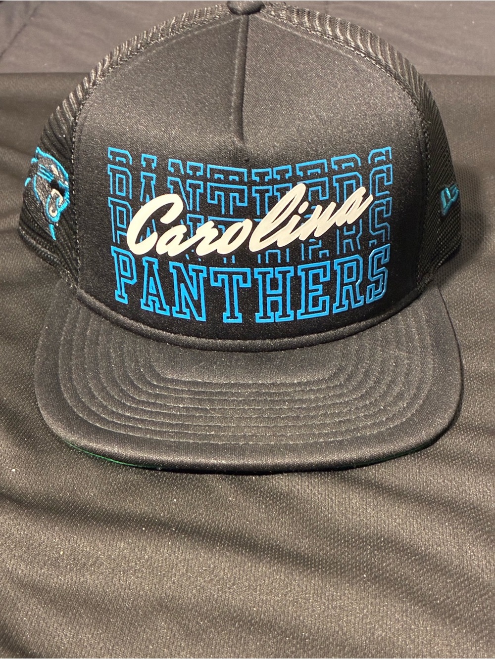 New Era Carolina Panthers Black and Teal Trucker Hat
